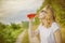 Young beautifil woman drinking red softdrink.