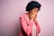 Young beautiful African American afro businesswoman with curly hair wearing pink jacket rubbing eyes for fatigue and headache,