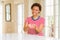 Young beautiful african american woman at home Smiling with hands palms together receiving or giving gesture