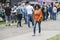 Young beautiful African woman in colorful clothes smiling walking at a street food festival in the town of Hale