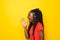 Young beautiful african woman screaming excited standing over yellow background