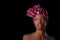 Young beautiful african woman wearing a traditional headscarf, I