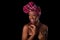 Young beautiful african woman wearing a traditional headscarf, I