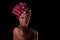 Young beautiful african woman wearing a traditional headscarf, I