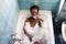 Young and beautiful Afro American woman takes a bubble bath in the bathtub. Beauty and hygiene concept