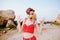 Young beautiful amazed pin up woman in red swimsuit