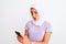 Young beautiful arabian girl wearing hijab using smartphone over isolated white background scared in shock with a surprise face,