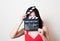 Young beautiful asian woman red dress smiling eyes with clapperboard