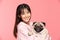 Young Beautiful Asian woman smile with clean and fresh skin Happiness and cheerful hold cute dog breed pug