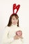 Young beautiful asian woman wearing Christmas antlers