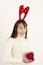 Young beautiful asian woman wearing Christmas antlers