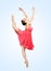 Young beautiful ballerina on a blu background