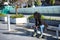 Young, beautiful, black woman with afro hair, with jacket and sunglasses sitting on a bench, looking at infinity, relaxed,