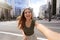 Young beautiful Brazilian woman with stylish wears takes self portrait on the Paulista Avenue, Sao Paulo, Brazil