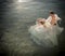 Young beautiful bridal couple outdoors in rock pool