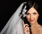 Young beautiful bride talking on mobile phone