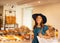 Young and beautiful brunette girl in dress and hat walking outdoor at the market. Nice, France. Summer vacation