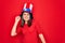 Young beautiful brunette woman wearing united states hat celebrating independence day Dancing happy and cheerful, smiling moving