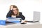 Young beautiful business woman suffering stress working at office computer desk load of paperwork