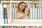 Young beautiful caucasian girl choosing books