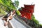 Young beautiful caucasian woman posing in front of the camera with the Koyasu pagoda on background, Kiyomizu-dera temple, Kyoto.