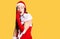 Young beautiful caucasian woman wearing santa claus costume hand on mouth telling secret rumor, whispering malicious talk