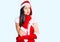Young beautiful caucasian woman wearing santa claus costume thinking worried about a question, concerned and nervous with hand on