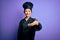 Young beautiful chinese chef woman wearing cooker uniform and hat over purple background smiling friendly offering handshake as