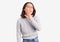Young beautiful chinese girl wearing casual clothes hand on mouth telling secret rumor, whispering malicious talk conversation