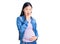 Young beautiful chinese woman pregnant expecting baby looking fascinated with disbelief, surprise and amazed expression with hands