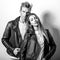 Young beautiful couple in black leather jackets. Black-white portrait.