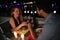 Young beautiful couple having romantic dinner on rooftop