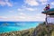 Young beautiful couple sitting on pillbox over looking Lanikai i