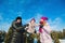 Young beautiful family in bright clothes winter fun jumping and running, snow, lifestyle, winter holidays