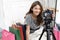 Young beautiful fashion blogger setting camera video with record