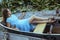 Young beautiful fashion model posing on boat