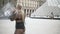 Young beautiful fashionable blonde girl in transparent dress and black underwear posing during video shooting near the