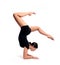 A young beautiful female gymnast in sportswear performs a handstand. Training, element of gymnastics, acrobatic