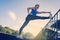 Young beautiful fitness girl doing stretching at stadium. Sports, health care concept