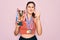 Young beautiful fitness winner athlete woman wearing sport medals and trophy annoyed and frustrated shouting with anger, crazy and