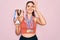 Young beautiful fitness winner athlete woman wearing sport medals and trophy with happy face smiling doing ok sign with hand on