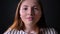 Young beautiful ginger woman looking at camera, isolated on black background, beauty portrait