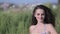 Young beautiful girl in bikini posing and dancing in beach bar at sunset