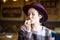 Young beautiful girl enjoying french fries in cafe