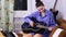 Young beautiful girl learning to play the guitar
