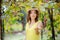 Young beautiful girl picking mellow grape in sunny day in Italy