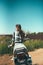 Young beautiful girl posing sitting on a motorcycle outdoors