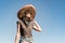 Young beautiful girl in sombrero and bandana dressed up as bandit of gangster. Female person in traditional mexican hat posing as