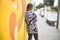 Young beautiful girl standing on backview at the town street