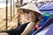 Young beautiful girl in a traditional Asian conical hat